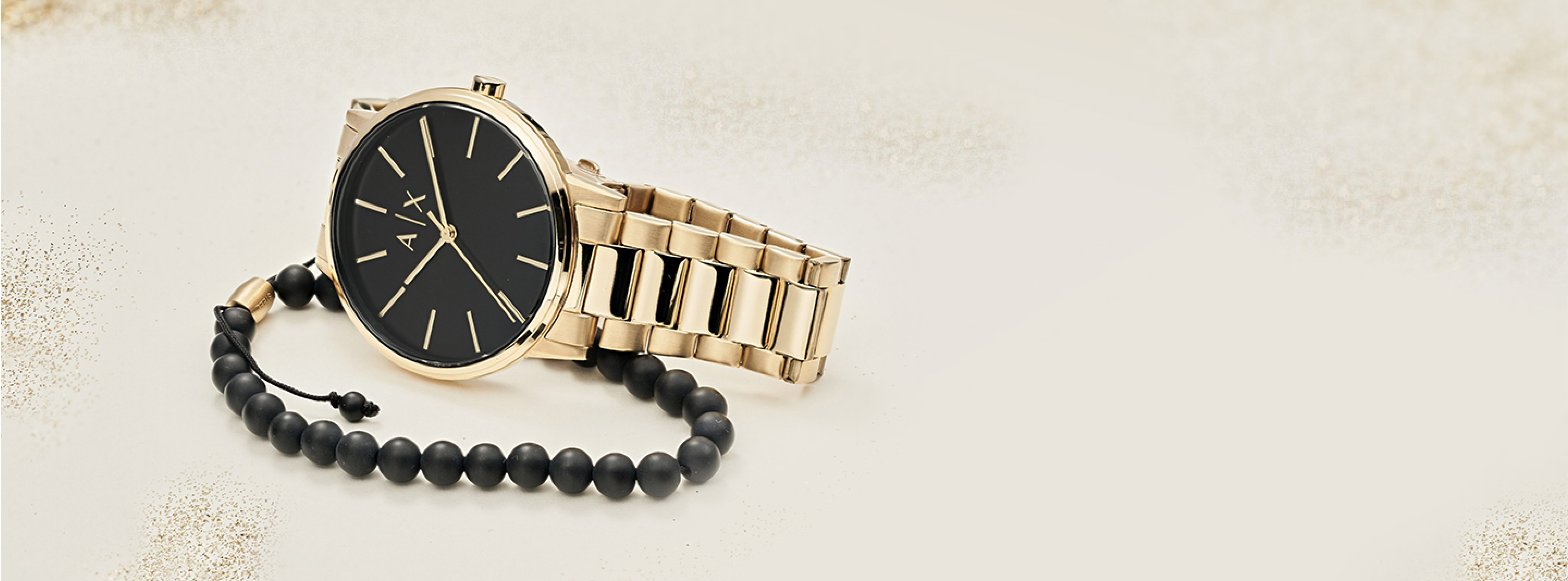 A|X gold-tone mens watch and coordinating black beaded bracelet. A|X gold-tone mens watch and coordinating black beaded bracelet.